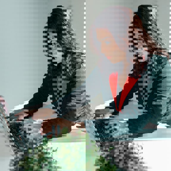 Woman typing on laptop