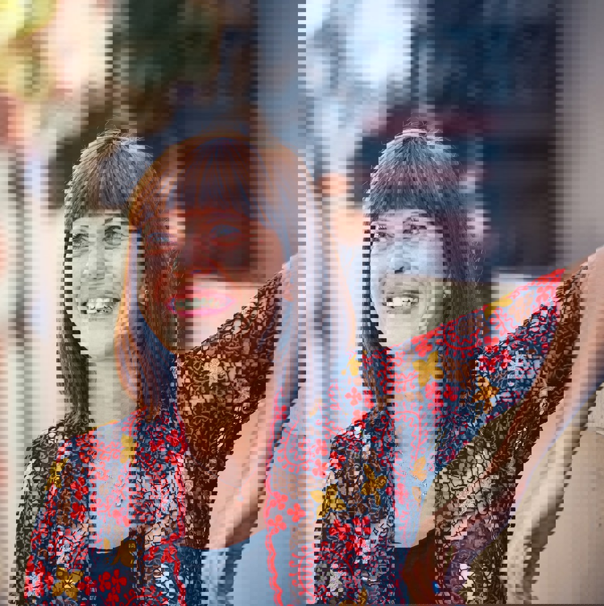 Woman smiling with red top